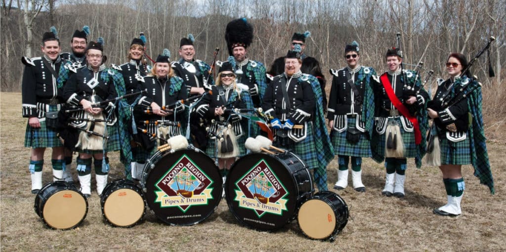 Pipe band band photo showing off custom pipe band drum heads